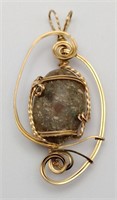 Gold tone wrapped Stone pendant