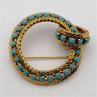 Gold tone blue rhinestone brooch