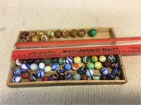 Vintage marbles in wooden box