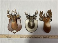 Chalkware deer, two wooden souvenir deer