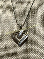 Gold heart pendant marked 10kp on chain