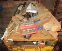 Contents on top of cabinet including wood clamp,
