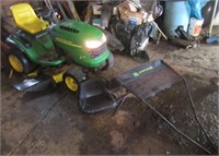 John Deere L130 automatic riding lawn mower with