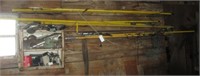 Assortment of pole saws and pole trimmers.