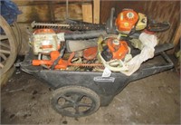 Rubbermaid cart with assortment of Stihl parts