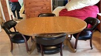 Kitchen table with 4 chairs that have wheels w