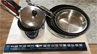 Assorted skillets and small pots