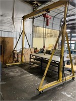 Crane. 9 foot adjustable height and 136 inches