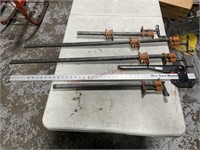 4- 3/4 pipe clamps. One with no tail piece