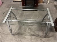 Metal office desk with glass top.