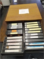 Variety of VHS tapes and container