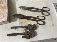Two pipe wrenches and two tinsnips