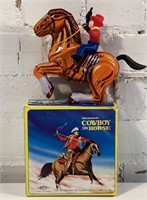Mechanical tin wind up cowboy on horse