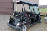 Tomberlin 4-seat golf cart, electric with charger.
