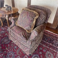 Down-filled needlepoint swivel chair