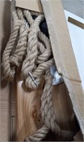 Wooden hanging shelf with rope