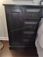 Black Wooden Storage Cabinet with drawers.