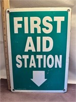 Metal First Aid Station sign.