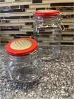 Pair of Red Top Glass Canisters