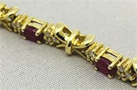 14KT YELLOW GOLD 6.50CTS RUBY & 1.00CTS DIA. BRAC.