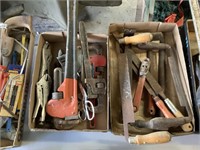 Assorted wood tools and pipe wrenchs