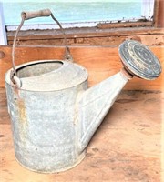 antique watering can