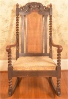 Jacobean Style Carved Oak Rocking Chair.