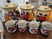 Set of glass pots and cups with fruit on them