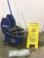 Industrial mop, bucket and wet floor sign.