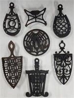 7 Cast Iron Footed Trivets