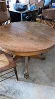 44” oak antique table with claw feet