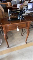 Singer vintage sewing machine in cabinet?