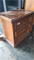 3 drawer wooden nightstand. Approximately