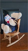 Plush bear with wooden rocking chair.