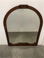 Carved horseshoe shaped wall mirror