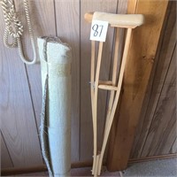 rug and wooden crutches