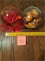 2  glass balls with flowers inside