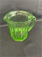 Green depression glass pitcher, A & J