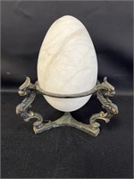 Marble egg in decorative metal holder