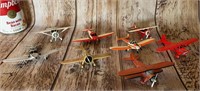 8 small plastic airplanes