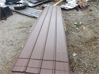 roughly 40 sheets of bright brown roofing metal