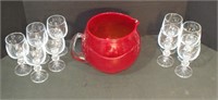 RED GLASS PITCHER WITH 9 GLASSES