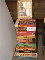 Stack of vintage games, jigsaw puzzles,