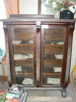 Antique display cabinet with glass doors and