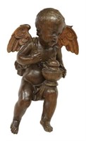 LARGE CONTINENTAL CARVED OAK PUTTO, 18TH C.