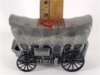 Pewter Coca-Cola covered wagon coin bank. Says ‘
