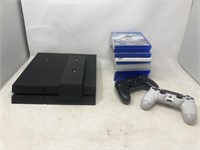 playstation 4 with two controllers, charging