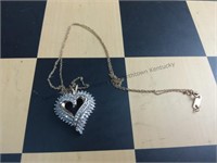 Heart-shaped diamond pendant containing 80 single
