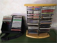 Approximately 30 Music CDs with holder