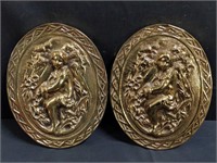 Pair of vintage repoussé brass wall plaques